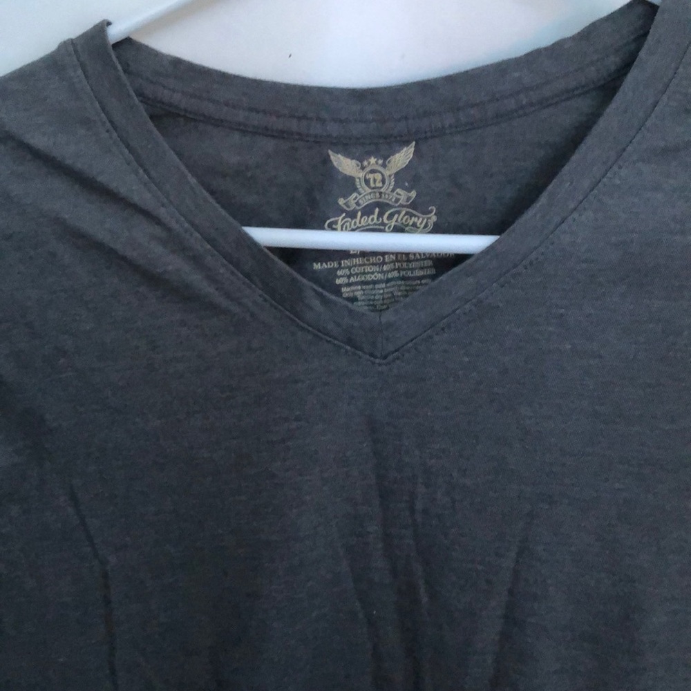 A long sleeve grey top,v-neck.